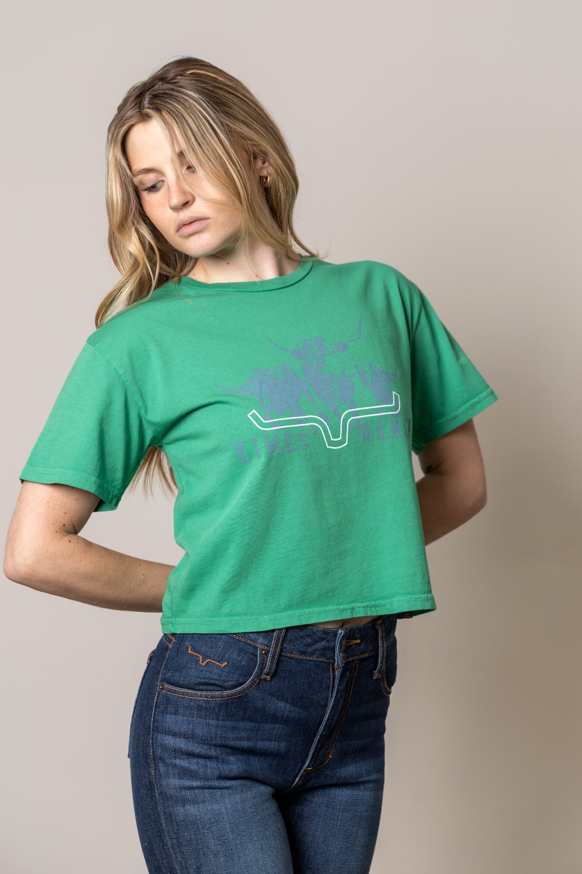 Kimes Ranch Movin' Out shirt in Kelly Green with a graphic featuring the Kimes Ranch logo and the Kimes Ranch logo