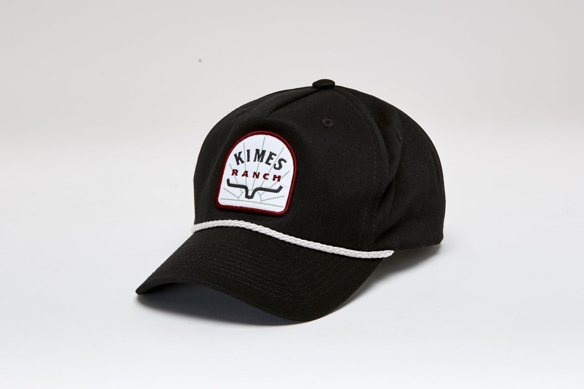 Kimes Ranch Mulligans Hat in Black with a white embroidered logo patch and white piping on the brim