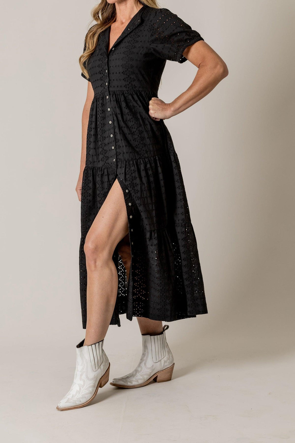 Kimes Ranch Neve Eyelet Dress in Black, side view, with a button-front, tiered skirt, and a side slit