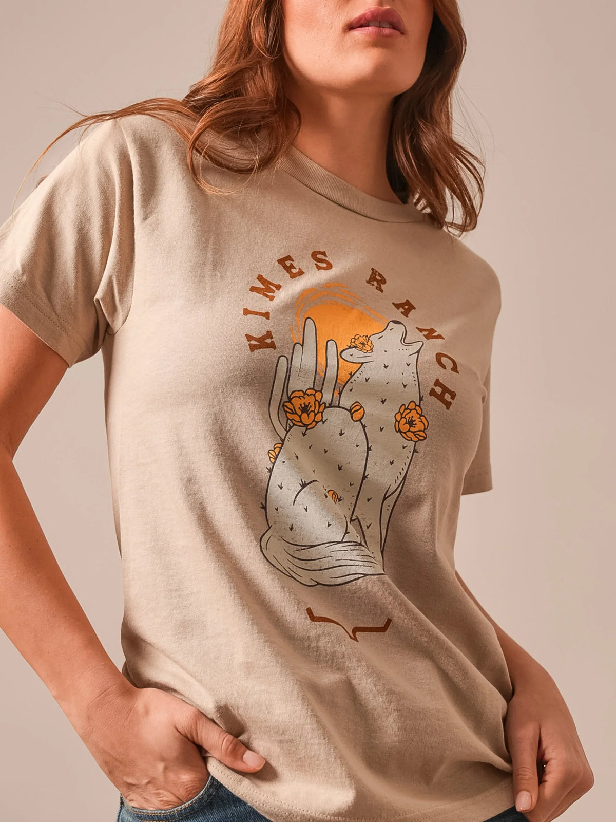 Kimes Ranch Night Call shirt in Sand with a graphic of a howling coyote and cactus with Kimes Ranch text