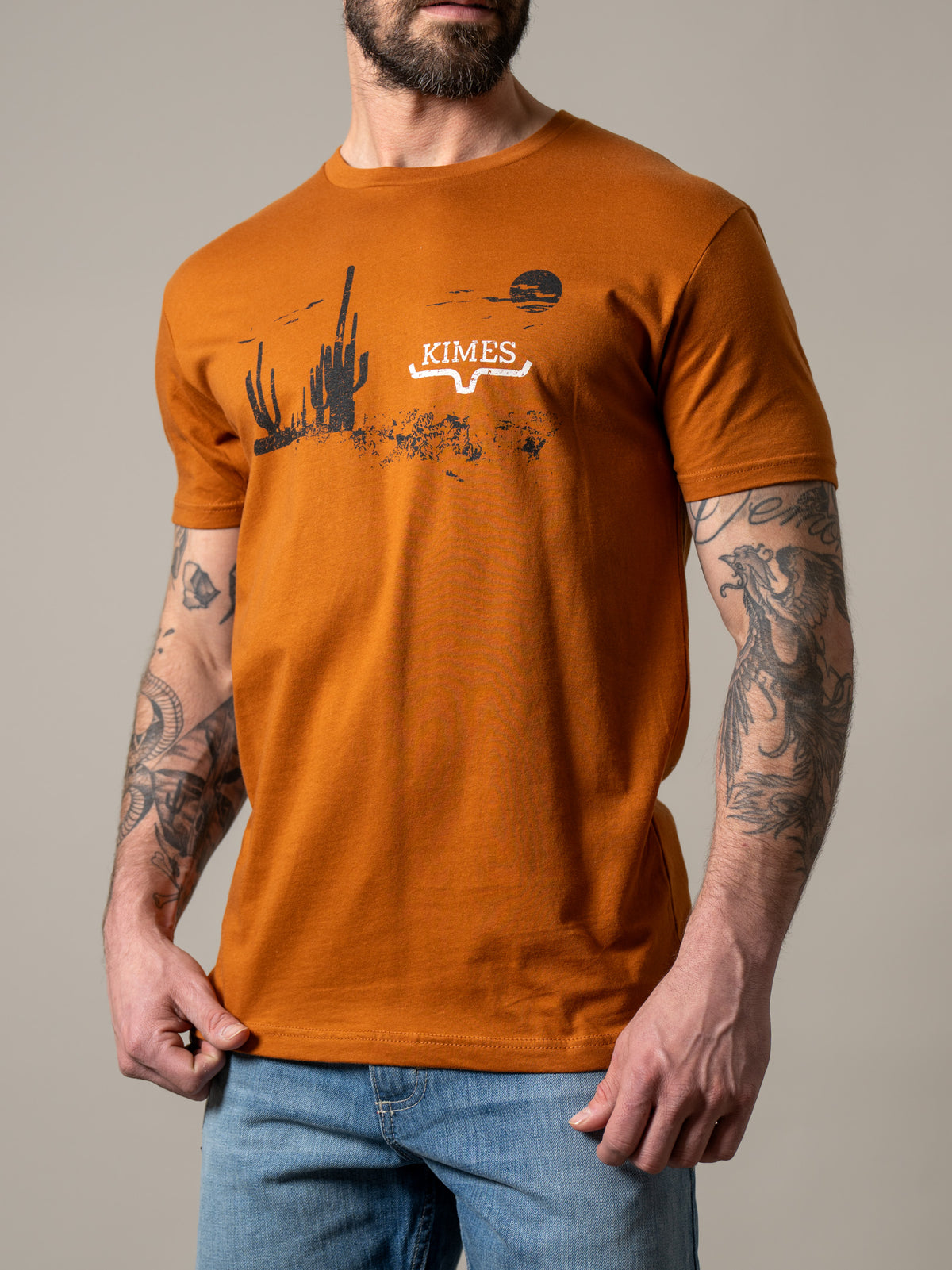 Kimes Ranch Night Fall shirt in Clay with a desert cactus graphic and the Kimes Ranch logo