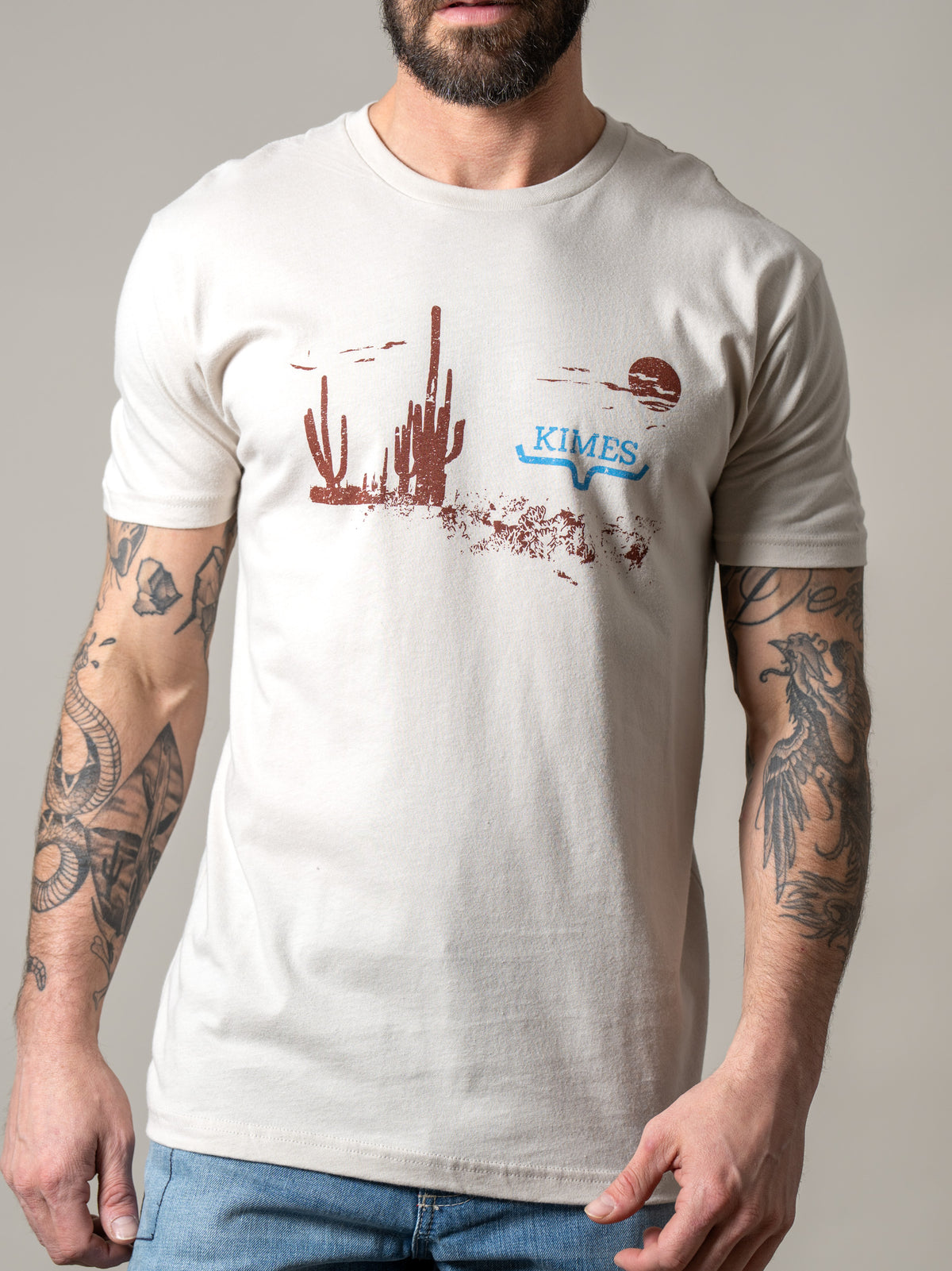 Kimes Ranch Night Fall shirt in Sand with a desert landscape graphic and Kimes Ranch logo
