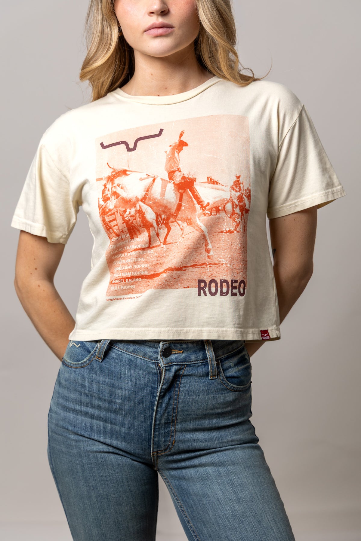 Kimes Ranch Not Our First shirt in Ivory with a rodeo graphic and RODEEO text