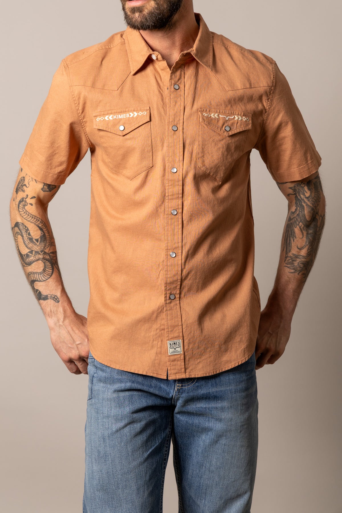 Kimes Ranch Nuce short sleeve dress shirt in Bran with embroidered chest pockets and a front logo patch