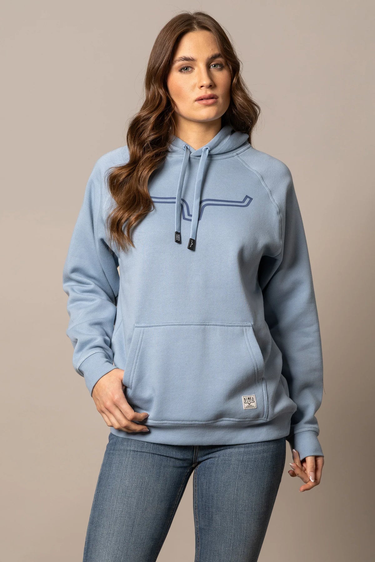 Kimes Ranch Ladies Outlier Hoodie in Carbon Blue with a longhorn graphic and front kangaroo pocket