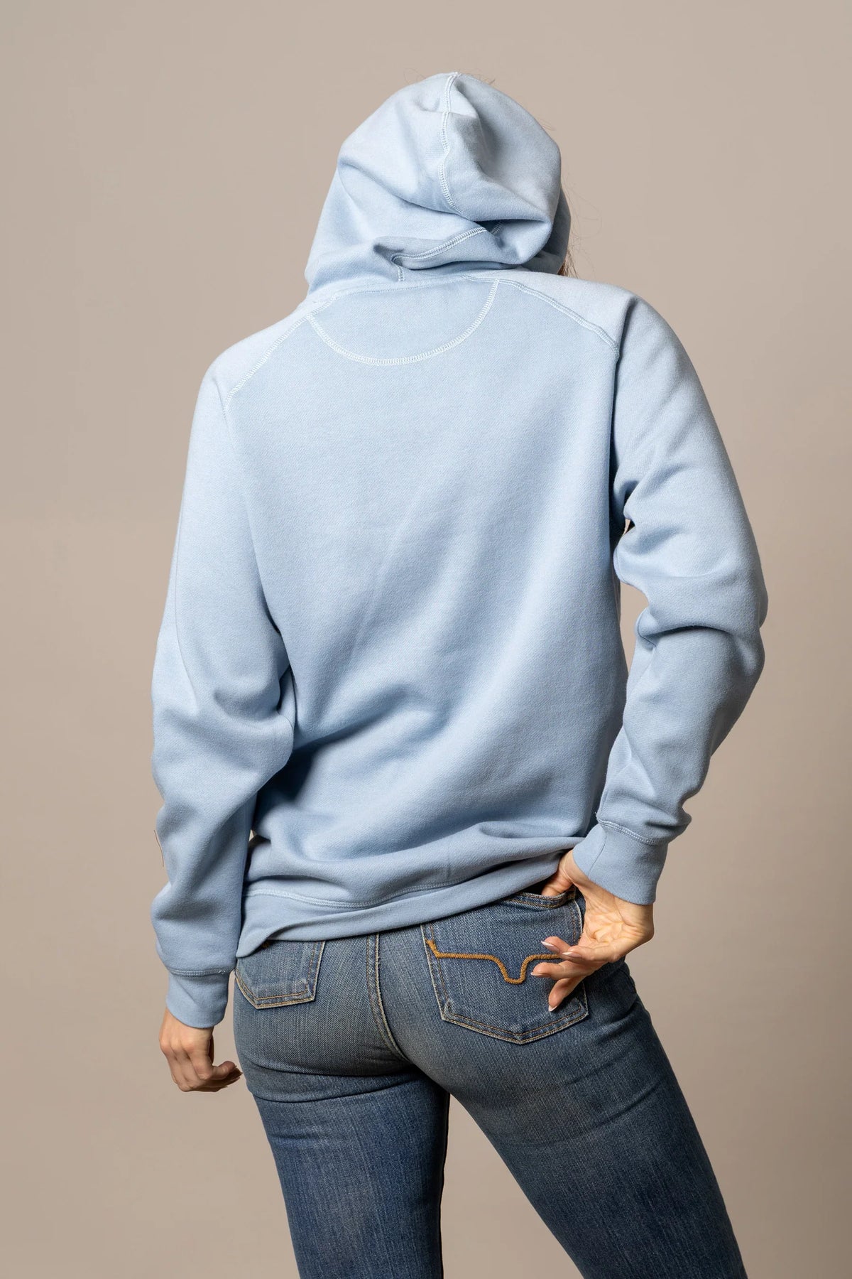 Kimes Ranch Ladies Outlier Hoodie in Carbon Blue, back view, with a back yoke and long sleeves