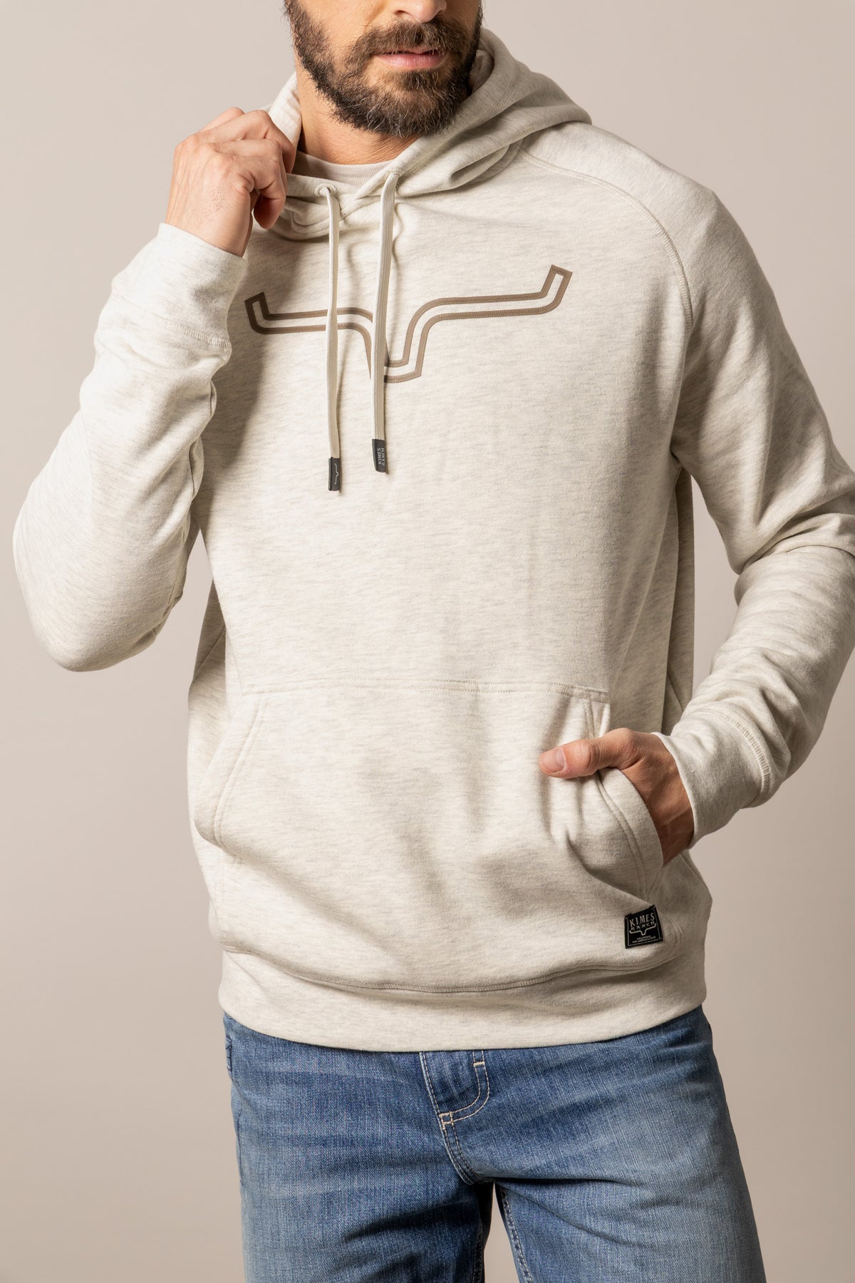 Kimes Ranch Outlier Hoodie in Natural Heather with a longhorn logo graphic on the chest and a front kangaroo pocket
