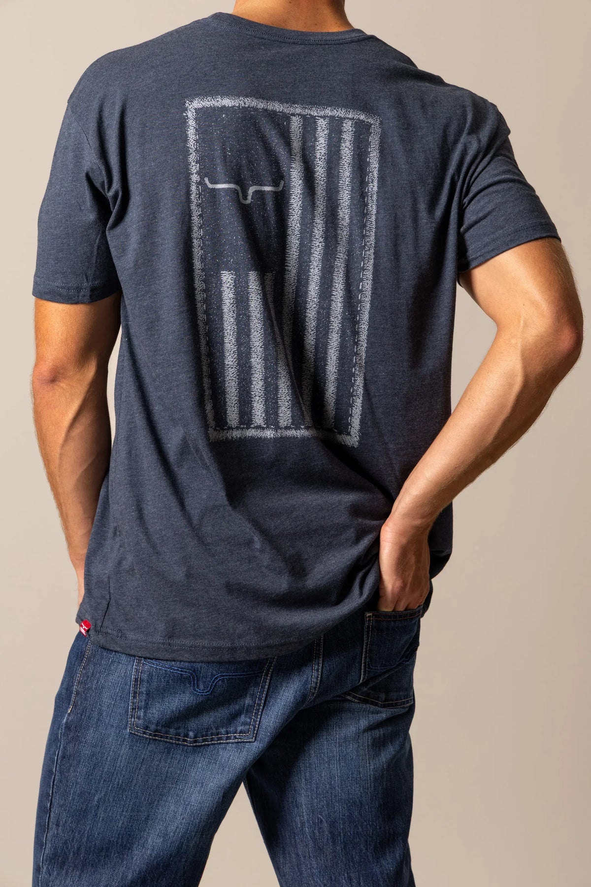 Kimes Ranch Patched shirt in Midnight Navy, back view, with a distressed Kimes Ranch logo on the back