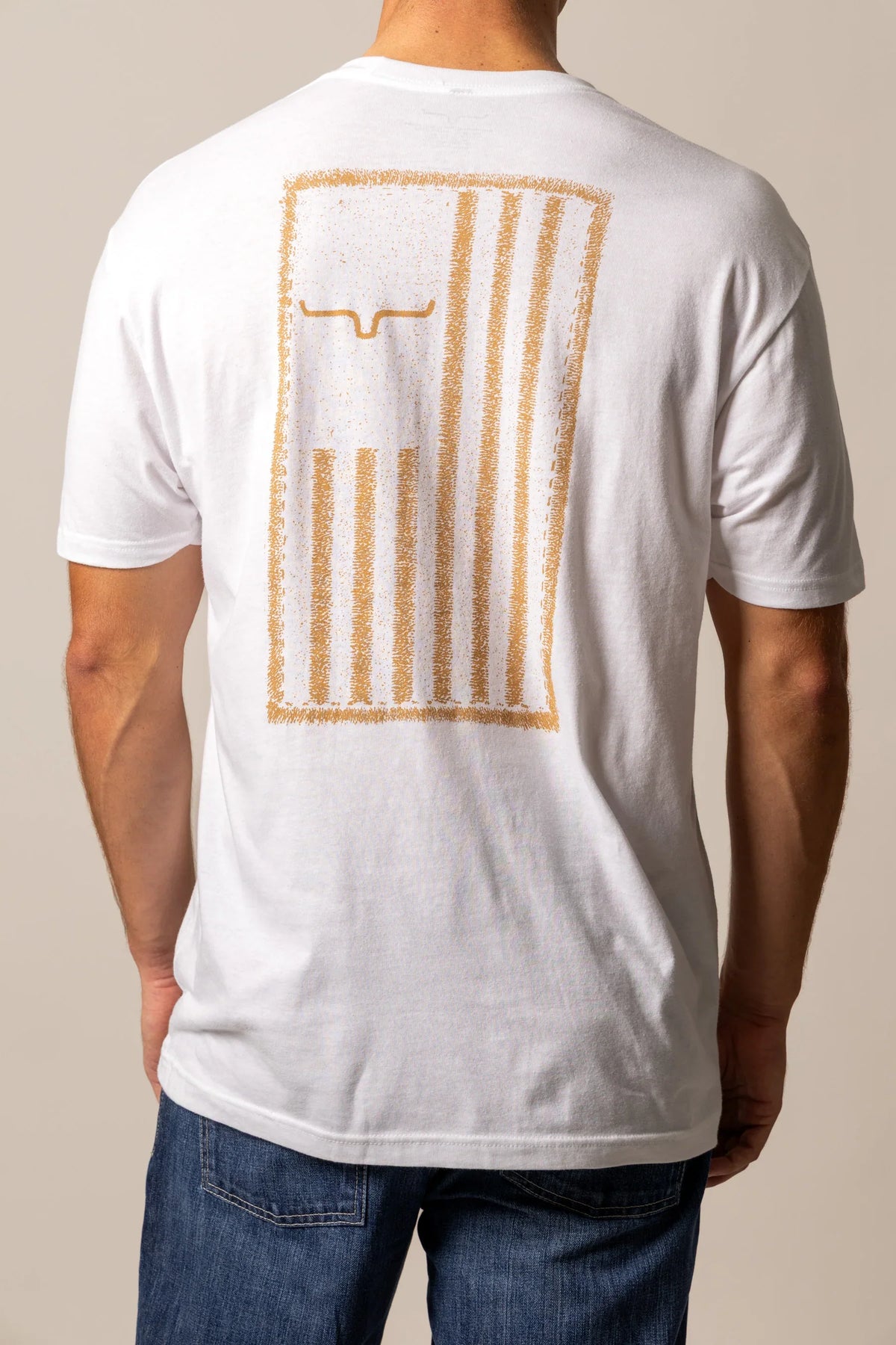 Kimes Ranch Patched, back view, shirt with a distressed gold Kimes Ranch logo on the back