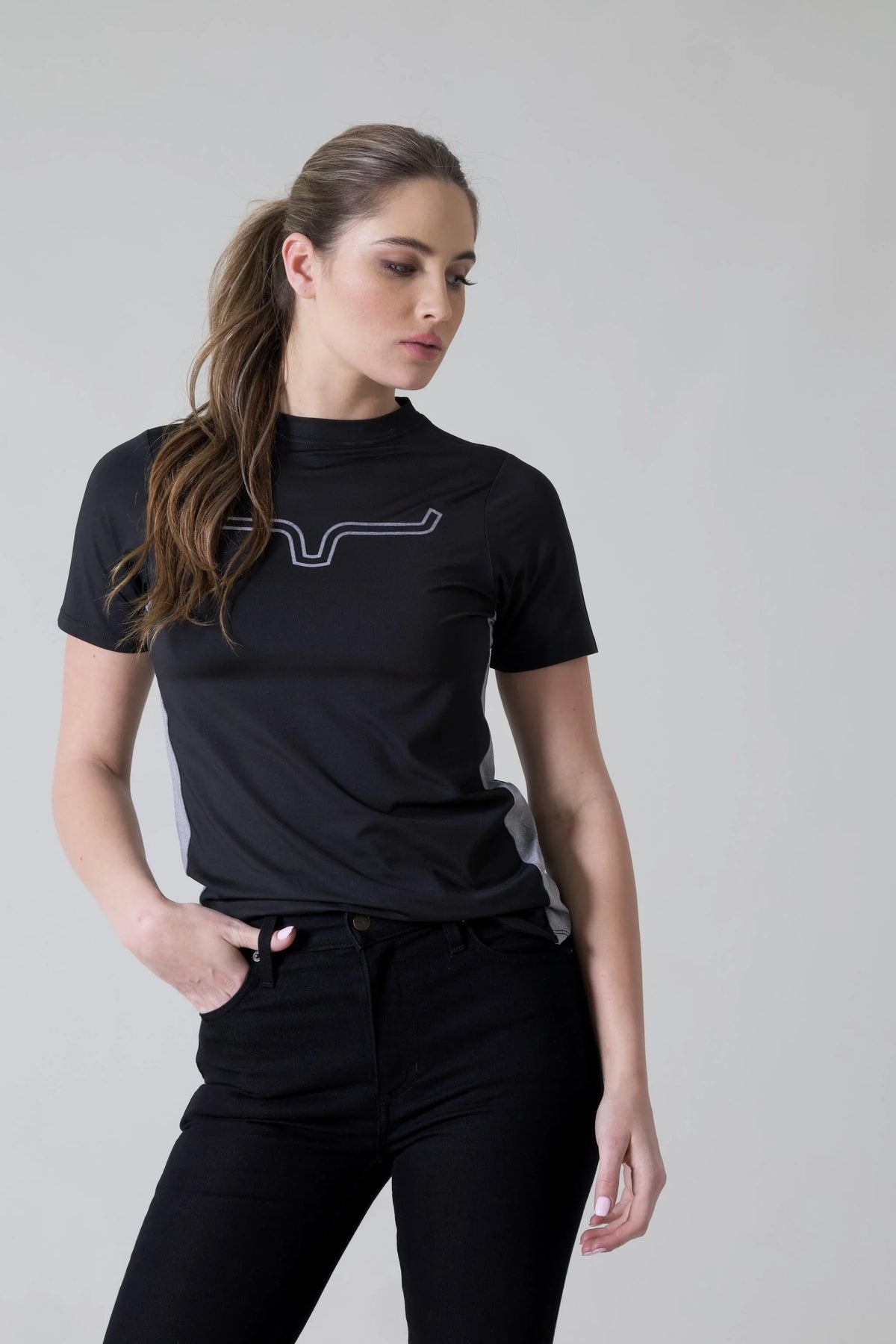 Kimes Ranch Ladies Phase 2 Tech Shirt in Black with a white logo and grey side panels