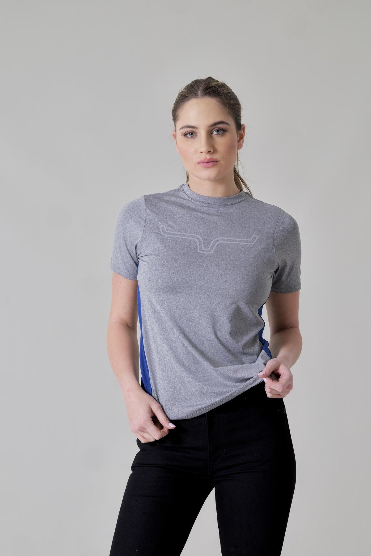 Kimes Ranch Ladies Phase 2 Tech Shirt in Grey Heather with blue side panels and a logo on the chest