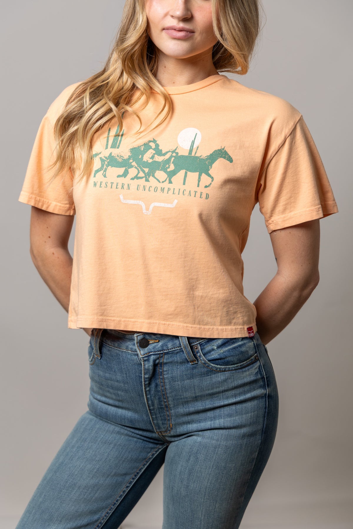 Kimes Ranch Plains Stampede shirt in Peach with a green Western Uncomplicated graphic