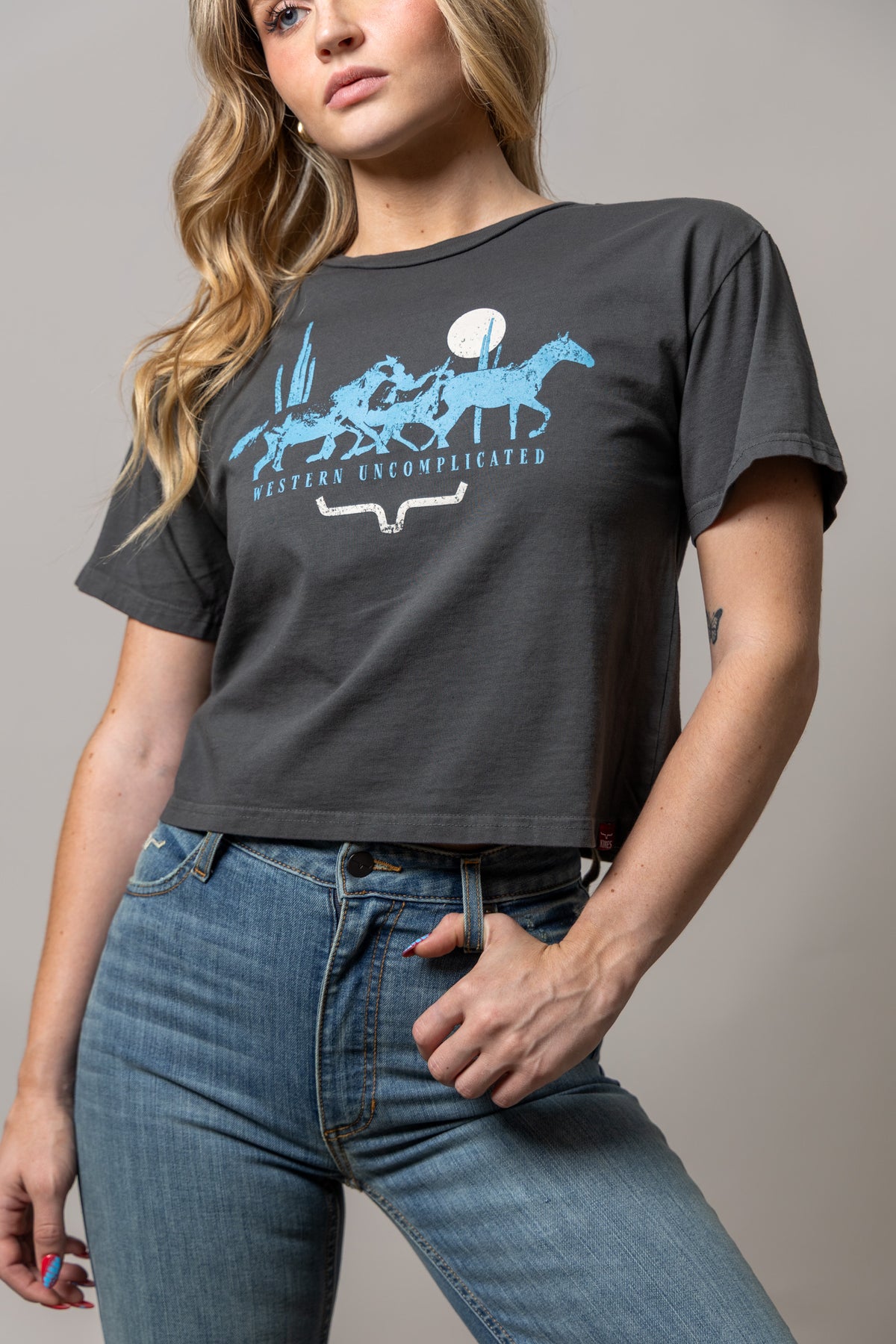 Kimes Ranch Plains Stampede shirt in Pepper with a blue horse graphic and Western Uncomplicated text