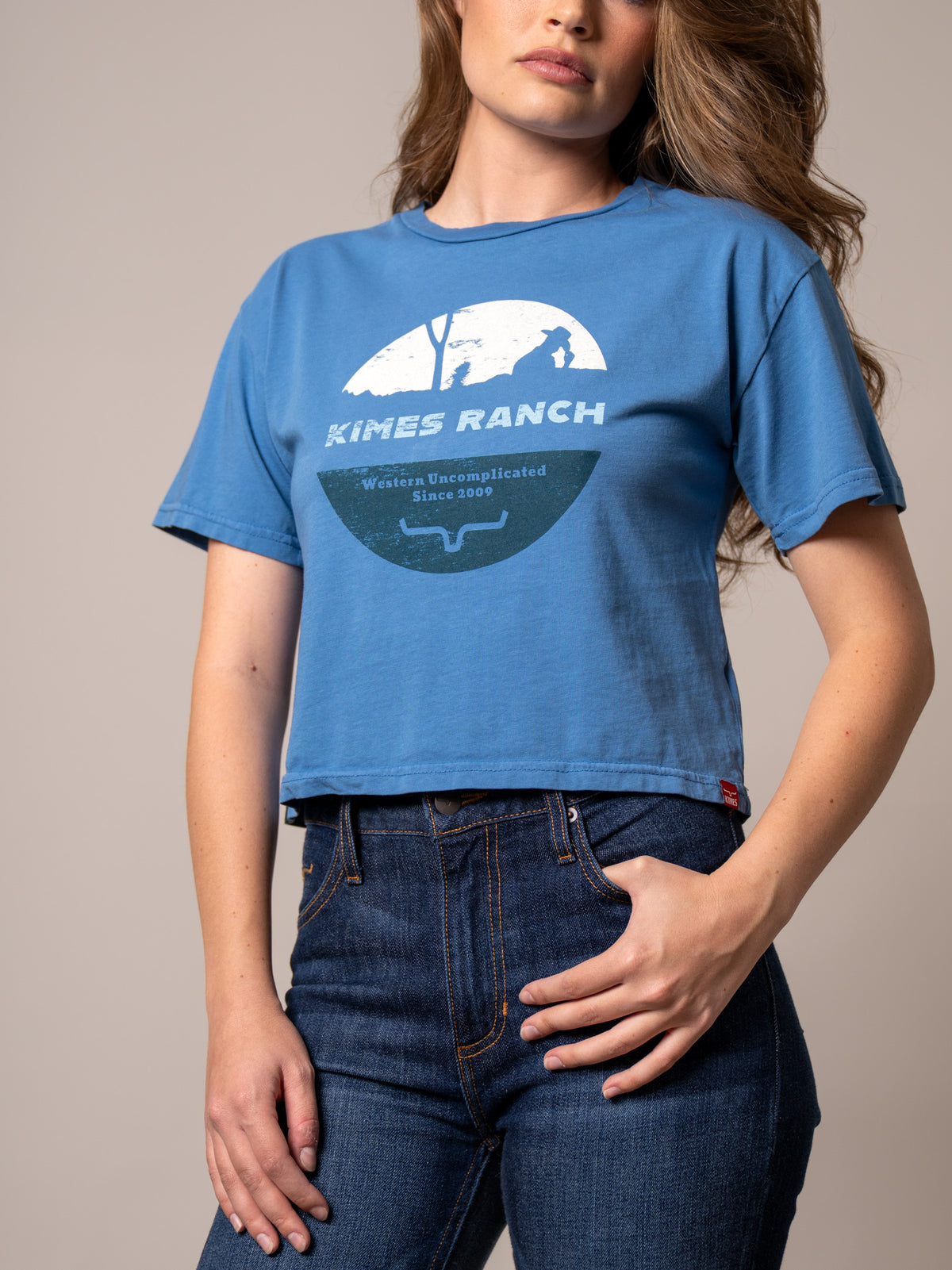 Kimes Ranch Rancher shirt in Carbon Blue with a cowboy graphic and Western Uncomplicated Since 2009 text