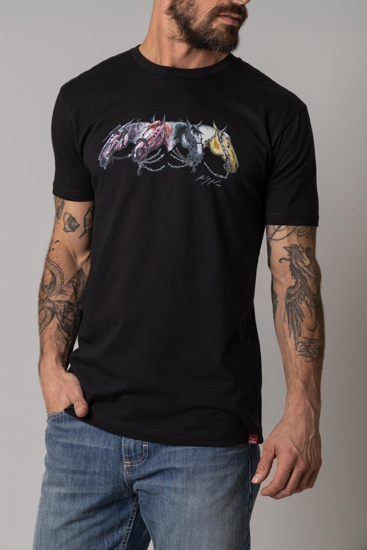 Kimes Ranch Randy Paul NRCHA Derby Tee Shirt in Black with a graphic of three horses in motion