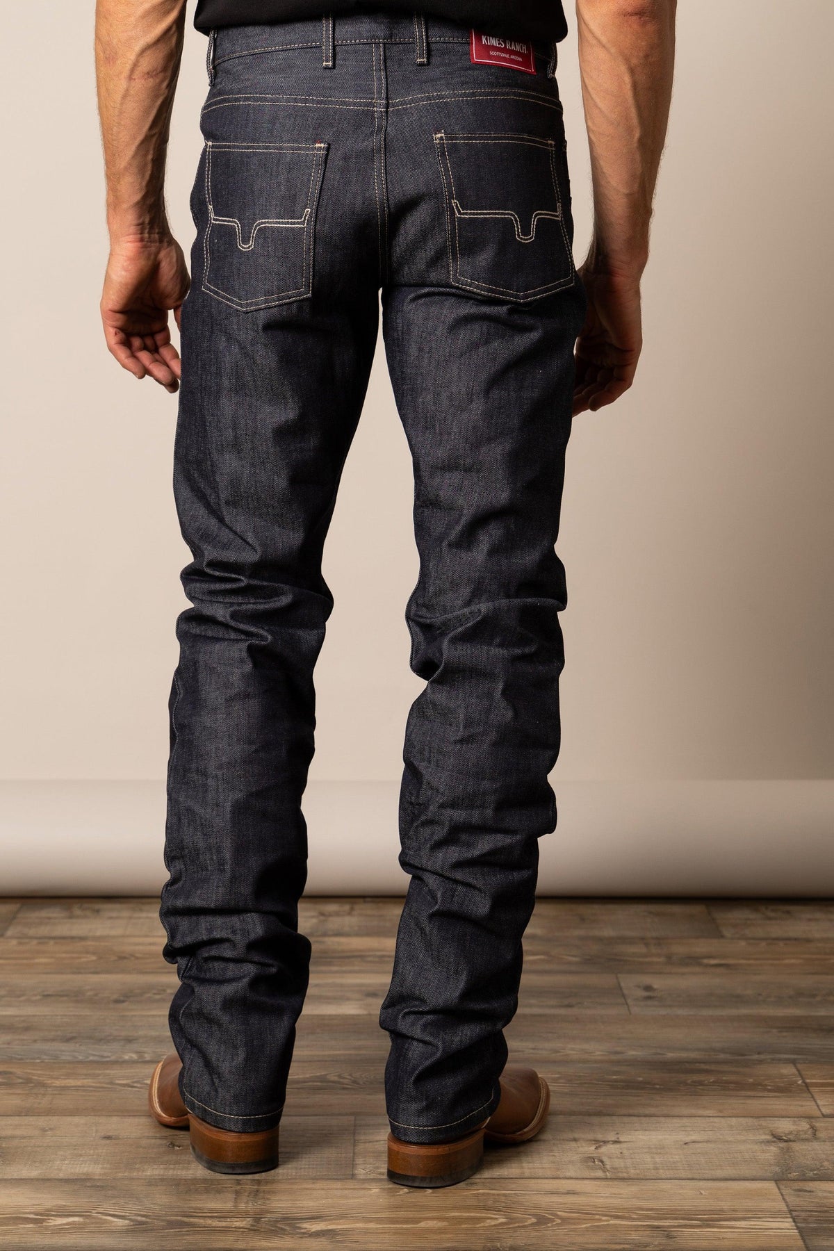 Kimes Ranch Raw James Straight Fit Bootcut jeans in Dark Wash, back view, with contrast stitching and back pockets