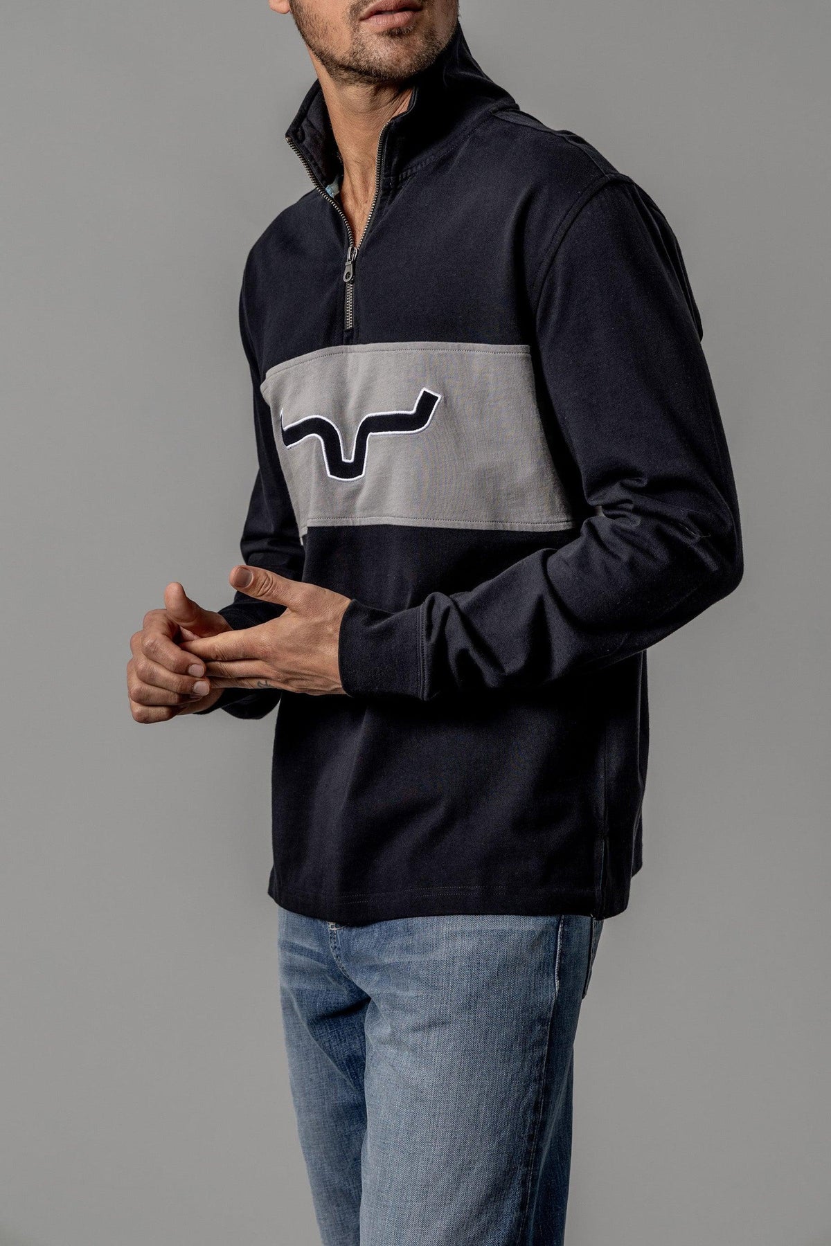 Kimes Ranch Razor Rugby sweatshirt in Black, side view, with a grey chest panel and the Kimes Ranch logo