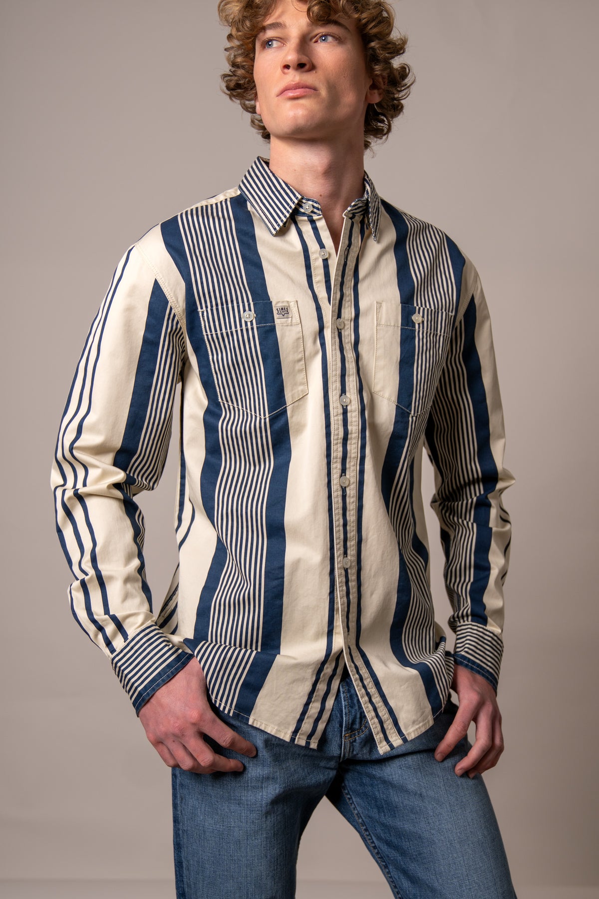Kimes Ranch Reddy dress shirt in Blue with wide vertical stripes and two chest pockets