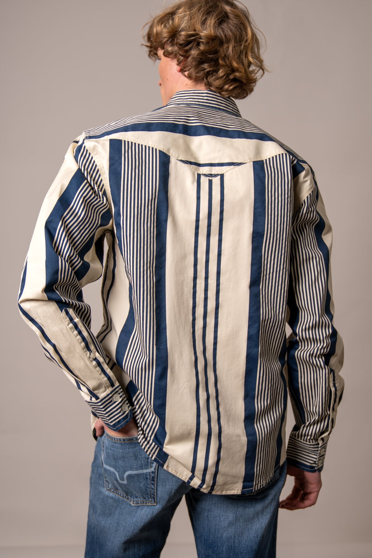 Kimes Ranch Reddy dress shirt in Blue, back view, with wide vertical stripes and a yoke detail