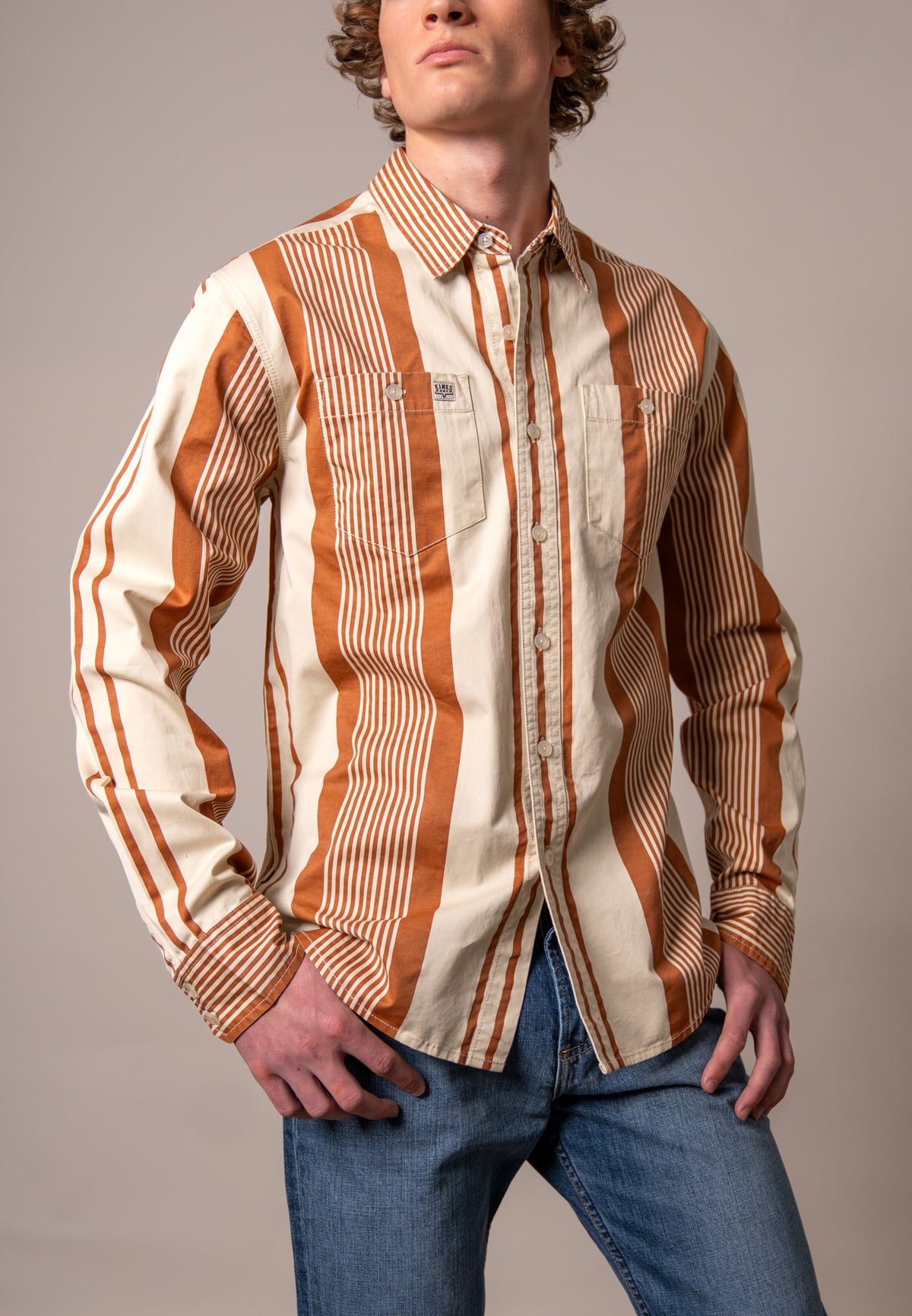 Kimes Ranch Reddy dress shirt in Bran with wide orange and cream vertical stripes and two chest pockets
