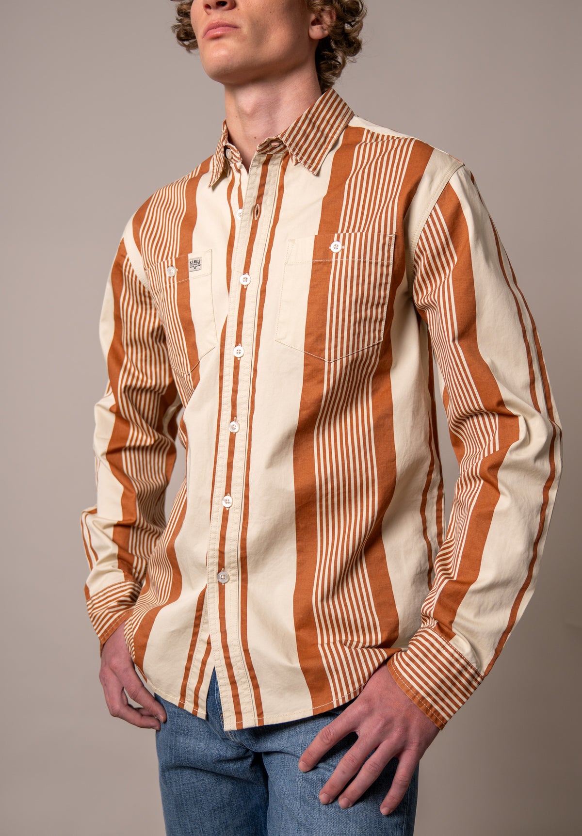 Kimes Ranch Reddy dress shirt in Bran with wide vertical stripes and two button flap chest pockets
