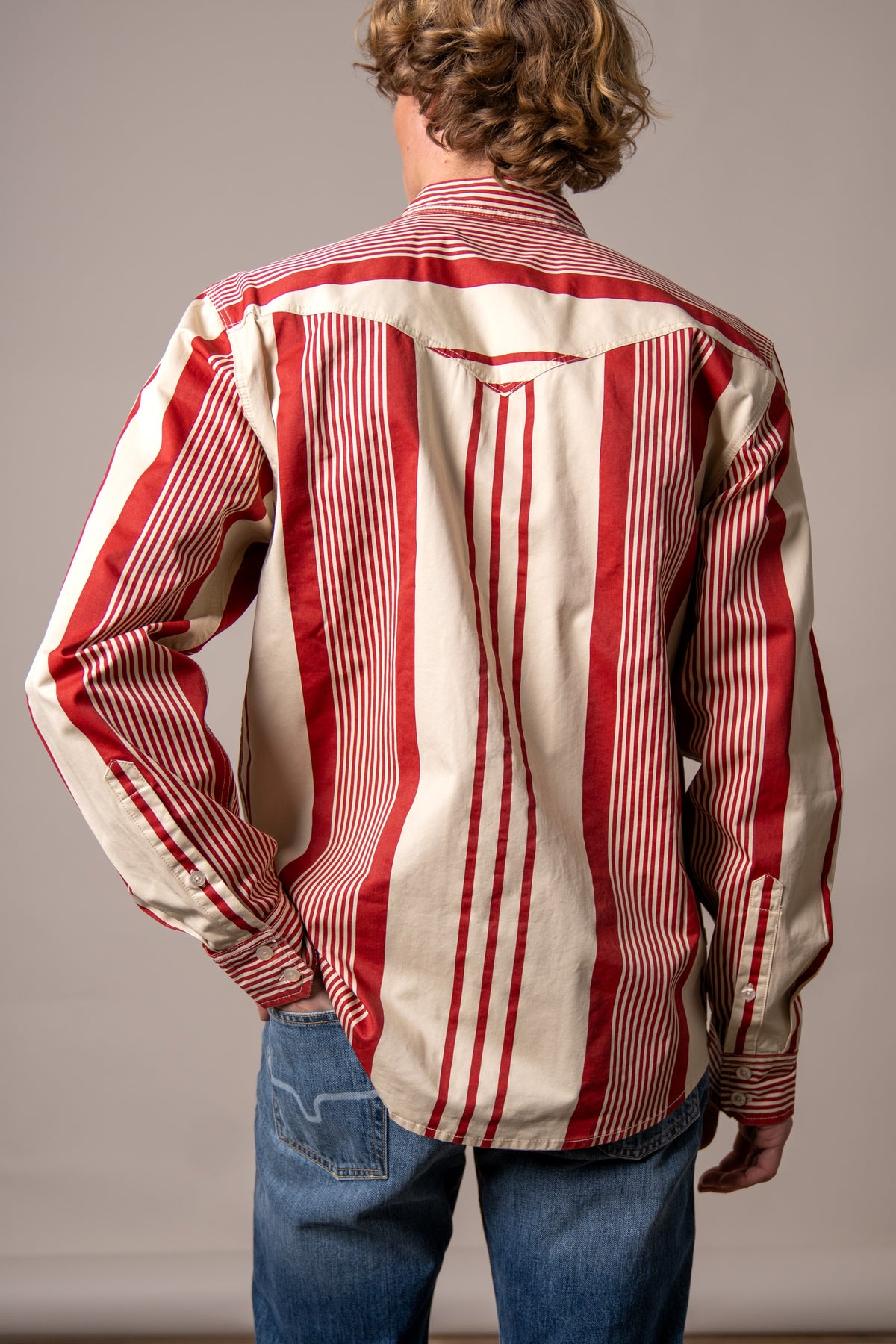 Kimes Ranch Reddy dress shirt in Brick Red, back view, with wide vertical stripes and a back yoke