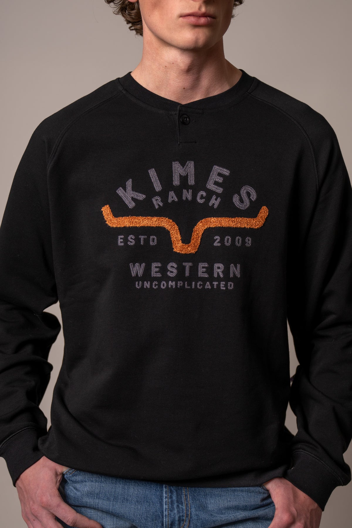 Kimes Ranch Reeves sweatshirt in Black with a front graphic featuring the Kimes Ranch logo and the text Western Uncomplicated