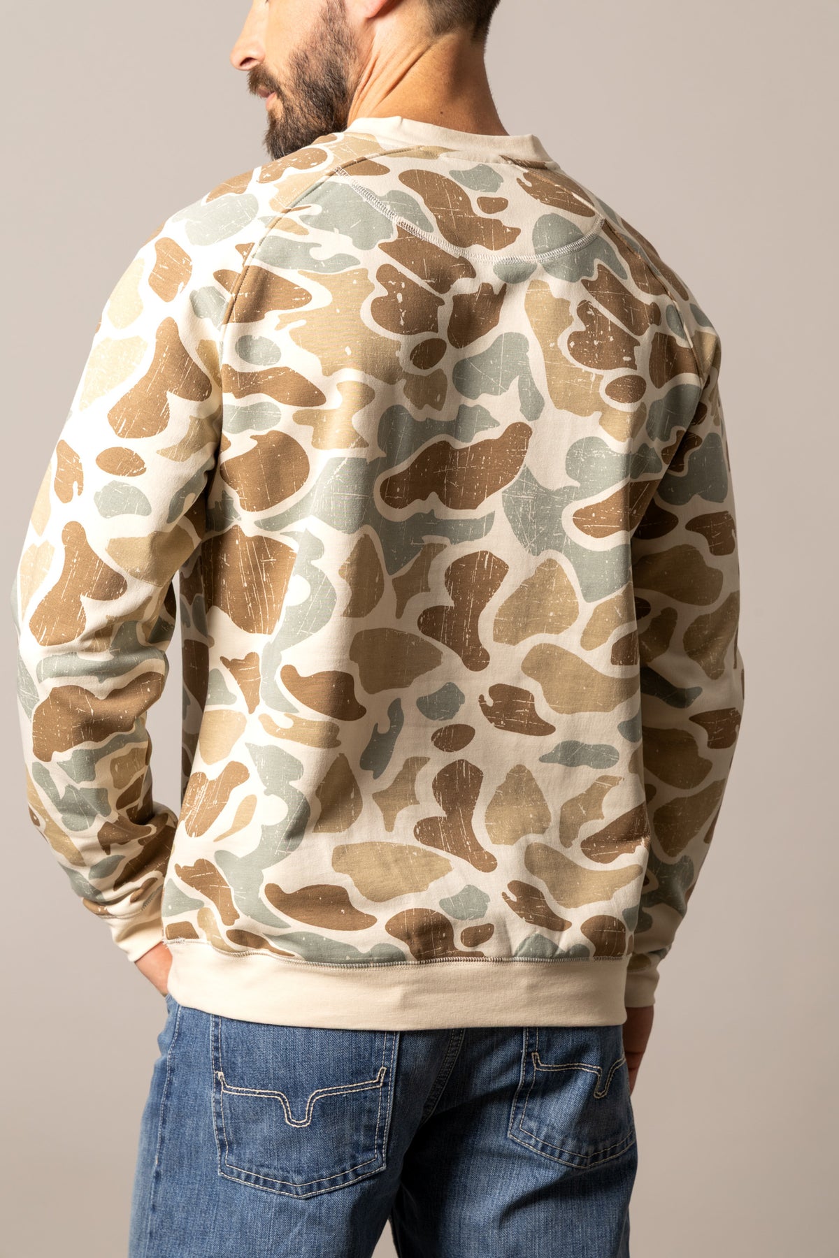 Kimes Ranch Reeves Sweatshirt in Desert Camo, back view, with a distressed camouflage pattern and ribbed crewneck