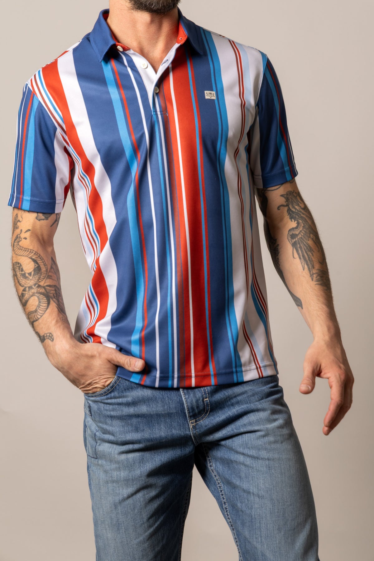 Kimes Ranch Rein polo shirt in Blue with vertical stripes in red, white, and light Blue