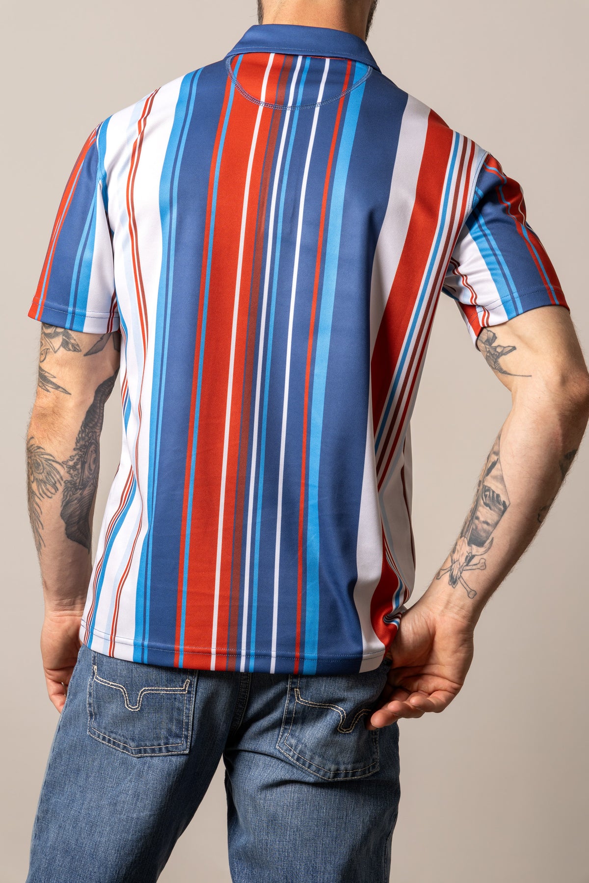 Kimes Ranch Rein polo with vertical stripes in Blue, back view, red, and white on the back