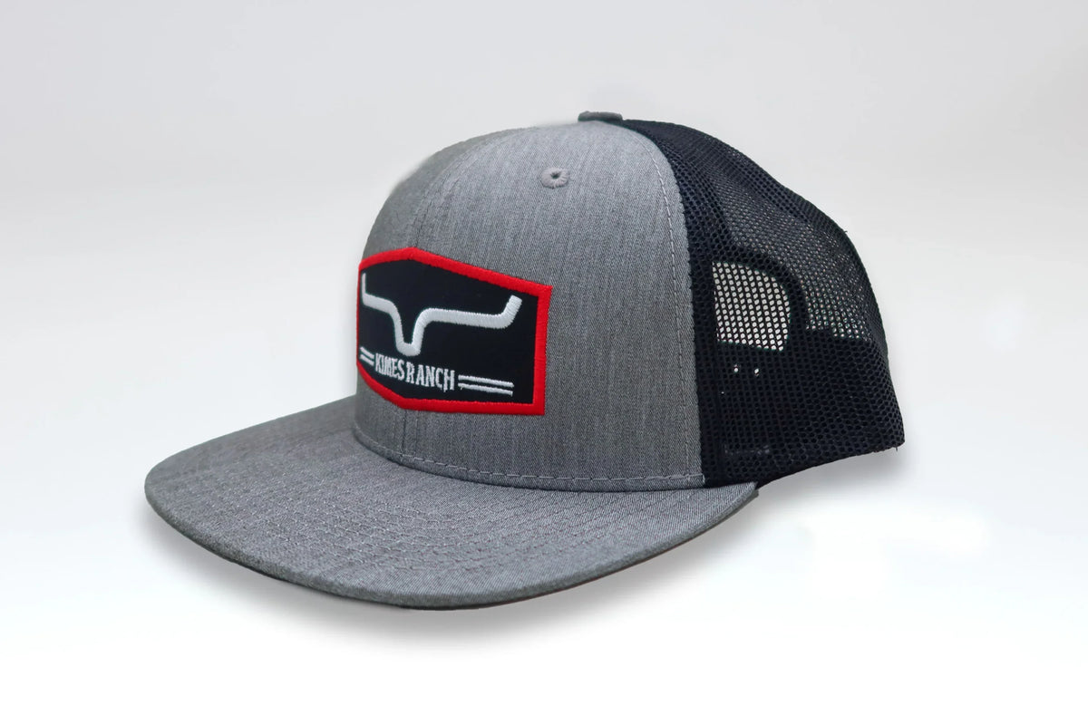 Kimes Ranch Replay Trucker Hat in Heather Grey, side view, with a mesh back and embroidered logo patch