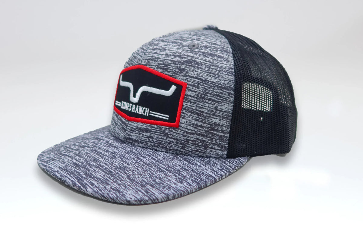 Kimes Ranch Replay Trucker Hat in Space Grey, side view, with a mesh back and embroidered logo patch