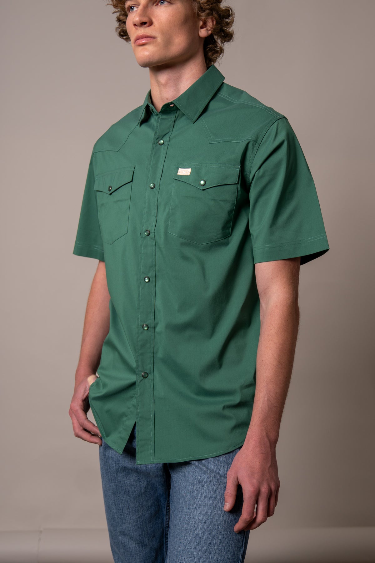 Kimes Ranch Rio Short Sleeve Dress Shirt in Forest with a western yoke and two buttoned chest pockets