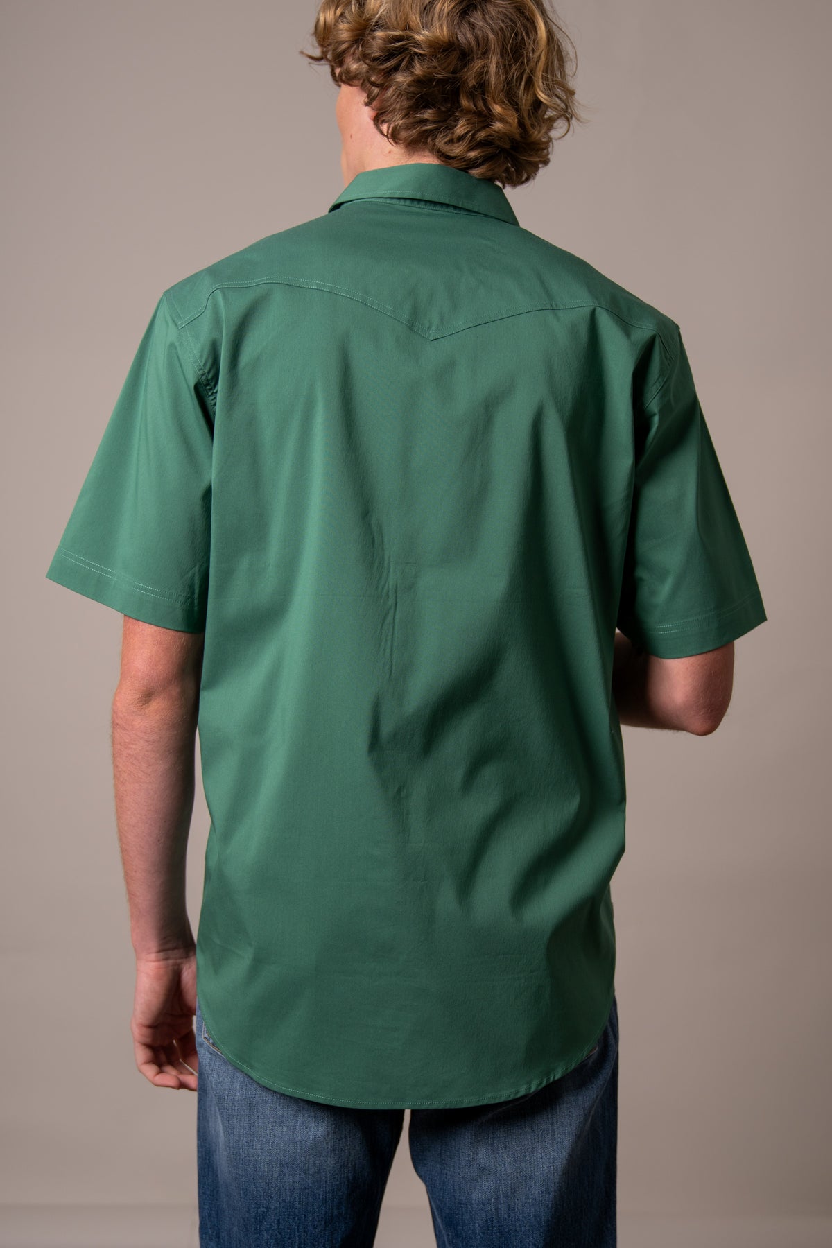 Kimes Ranch Rio Short Sleeve Dress Shirt in Forest, back view, with a back yoke and short sleeves