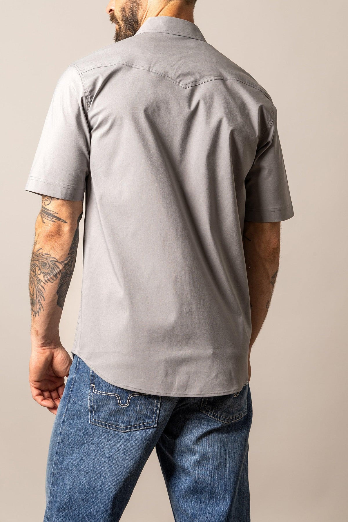 Kimes Ranch Rio Short Sleeve Dress Shirt in Grey, back view, with a back yoke and short sleeves