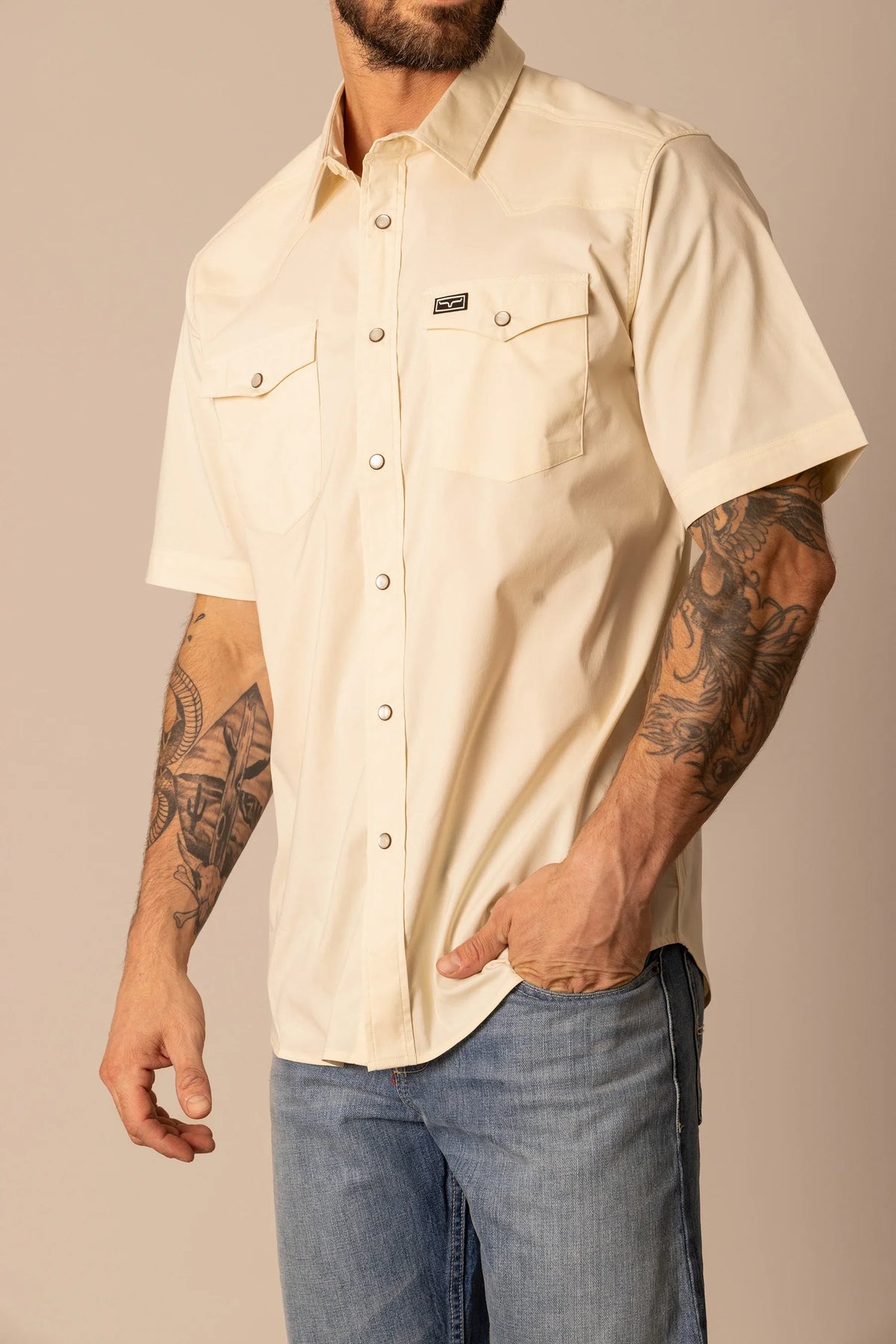 Kimes Ranch Rio Short Sleeve Dress Shirt in Natural with a western yoke and two chest pockets with snap closures