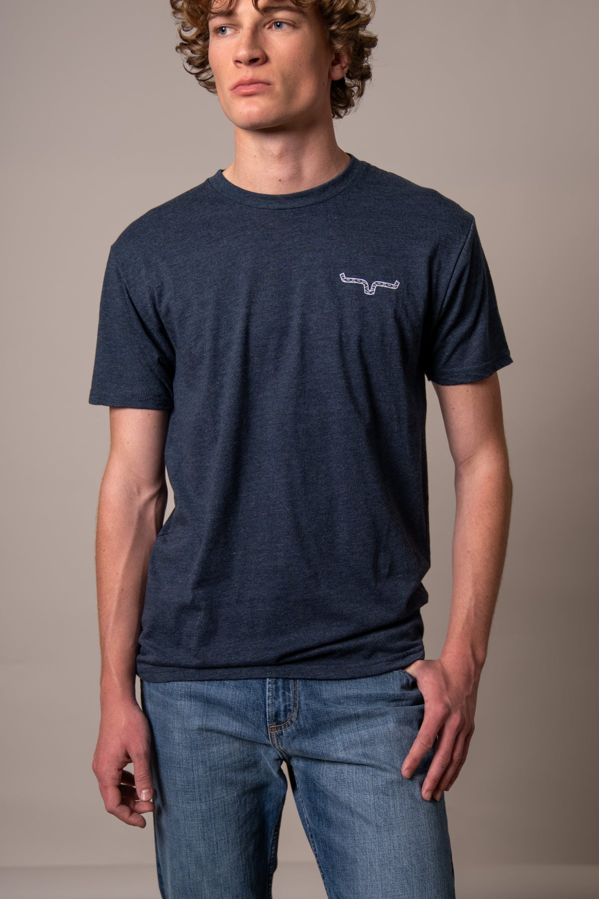 Kimes Ranch Rowell shirt in Midnight Navy with short sleeves and a crew neck with a white Kimes Ranch logo on the chest