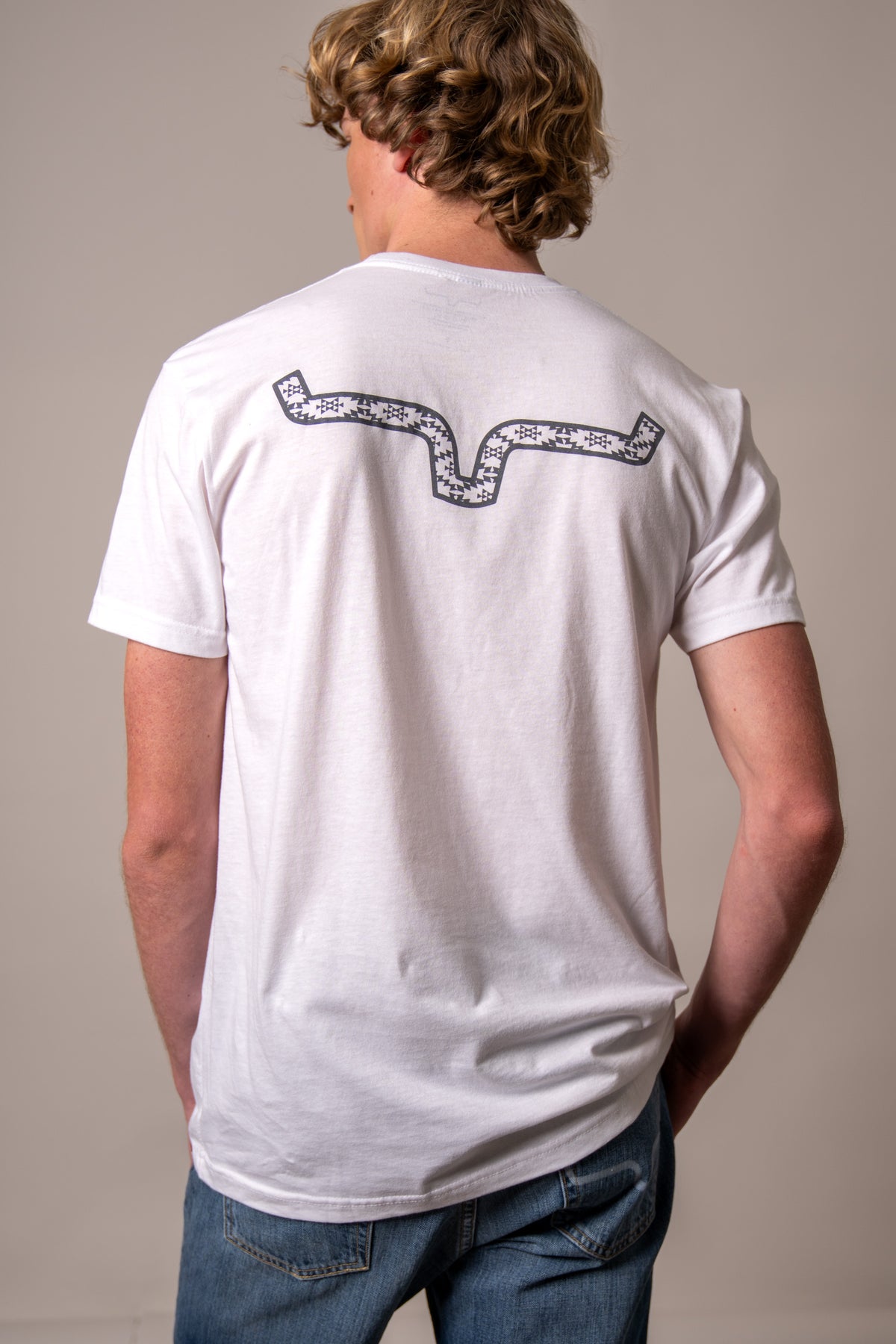 Kimes Ranch Rowell, back view, White t-shirt with a back yoke graphic in a houndstooth pattern