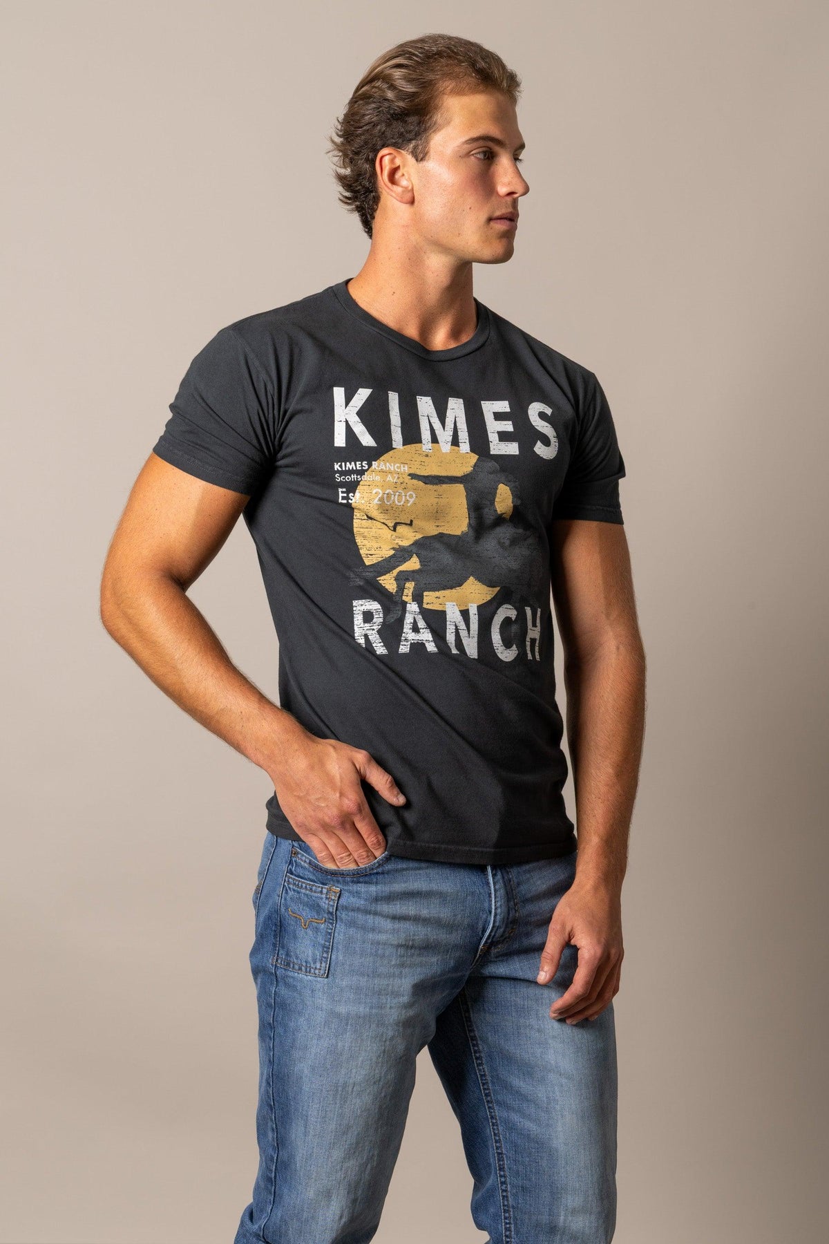 Kimes Ranch Runaway shirt in Black, side view, with a graphic print featuring the Kimes Ranch logo