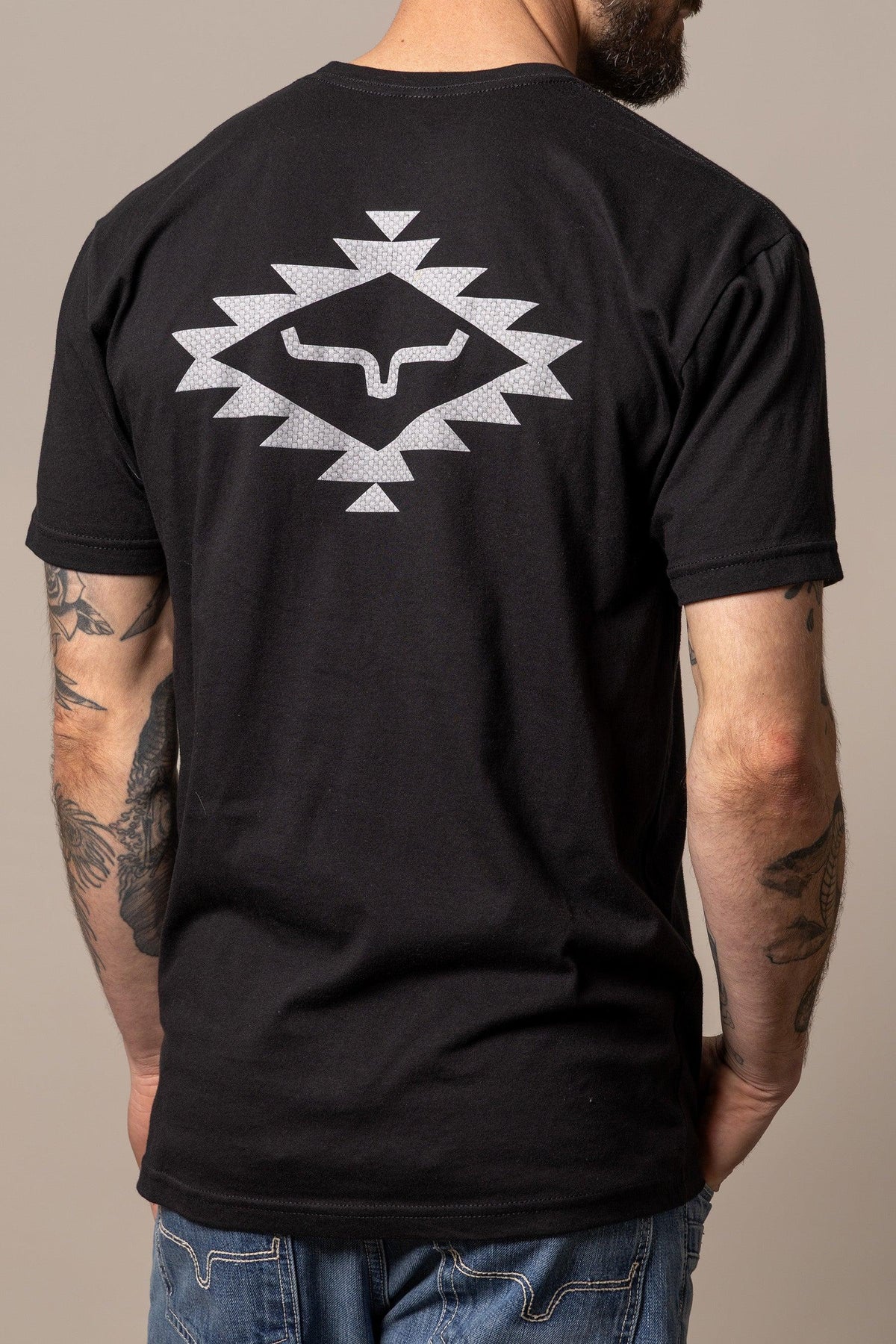 Kimes Ranch San Juan shirt in Black, back view, with a large silver geometric longhorn graphic on the back