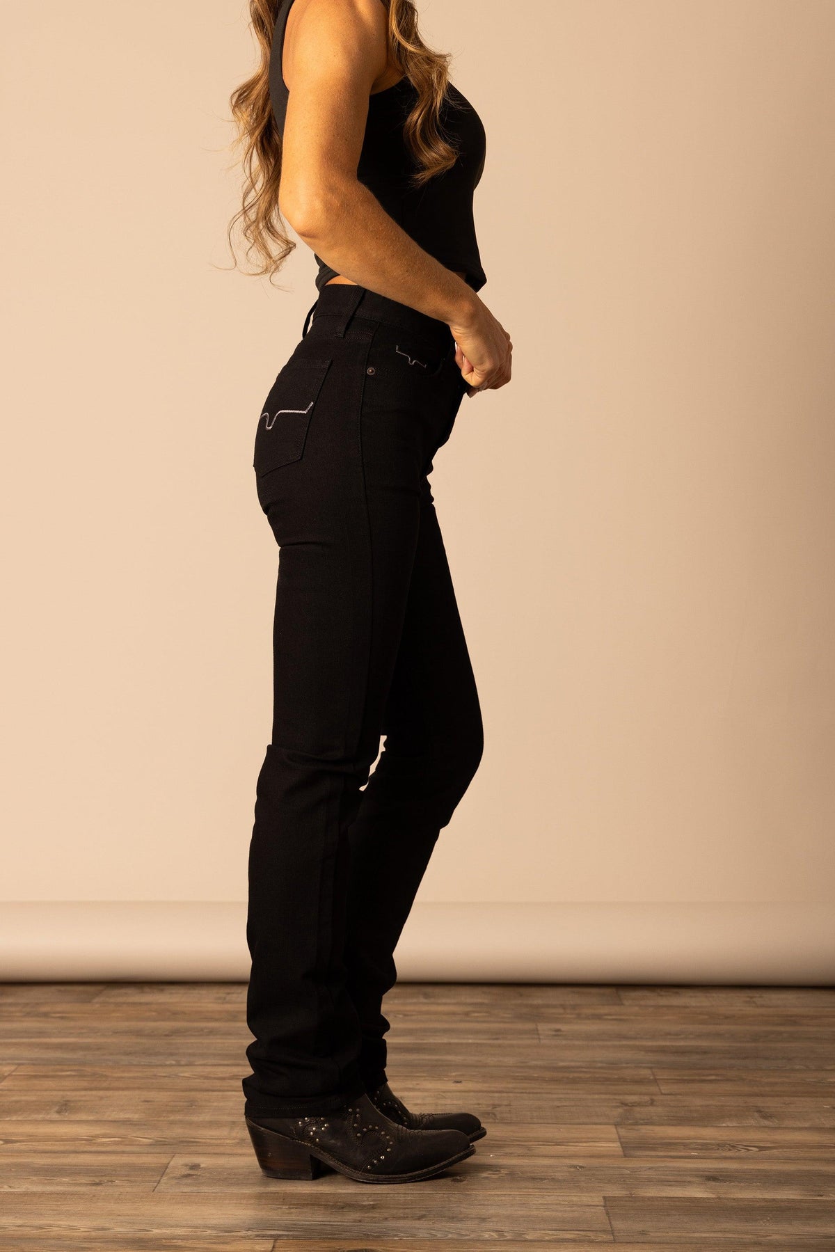 Kimes Ranch Sarah jeans in Black, side view, with the back pocket stitching and slim fit silhouette