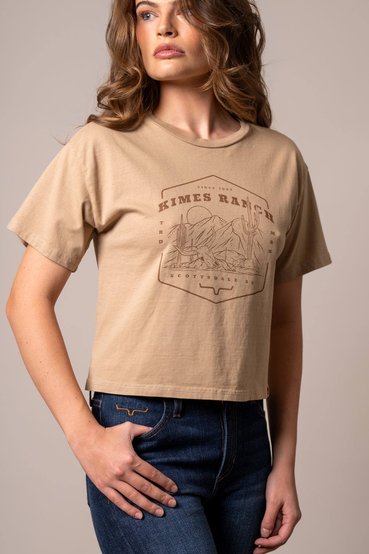 Kimes Ranch See For Miles shirt in Tan with a graphic print of a desert landscape and the words Kimes Ranch Scottsdale AZ