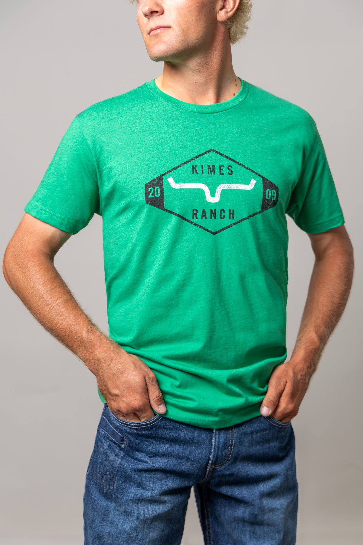 Kimes Ranch Serrano shirt in Kelly Green with a front graphic featuring the Kimes Ranch logo and the numbers 20 and 09