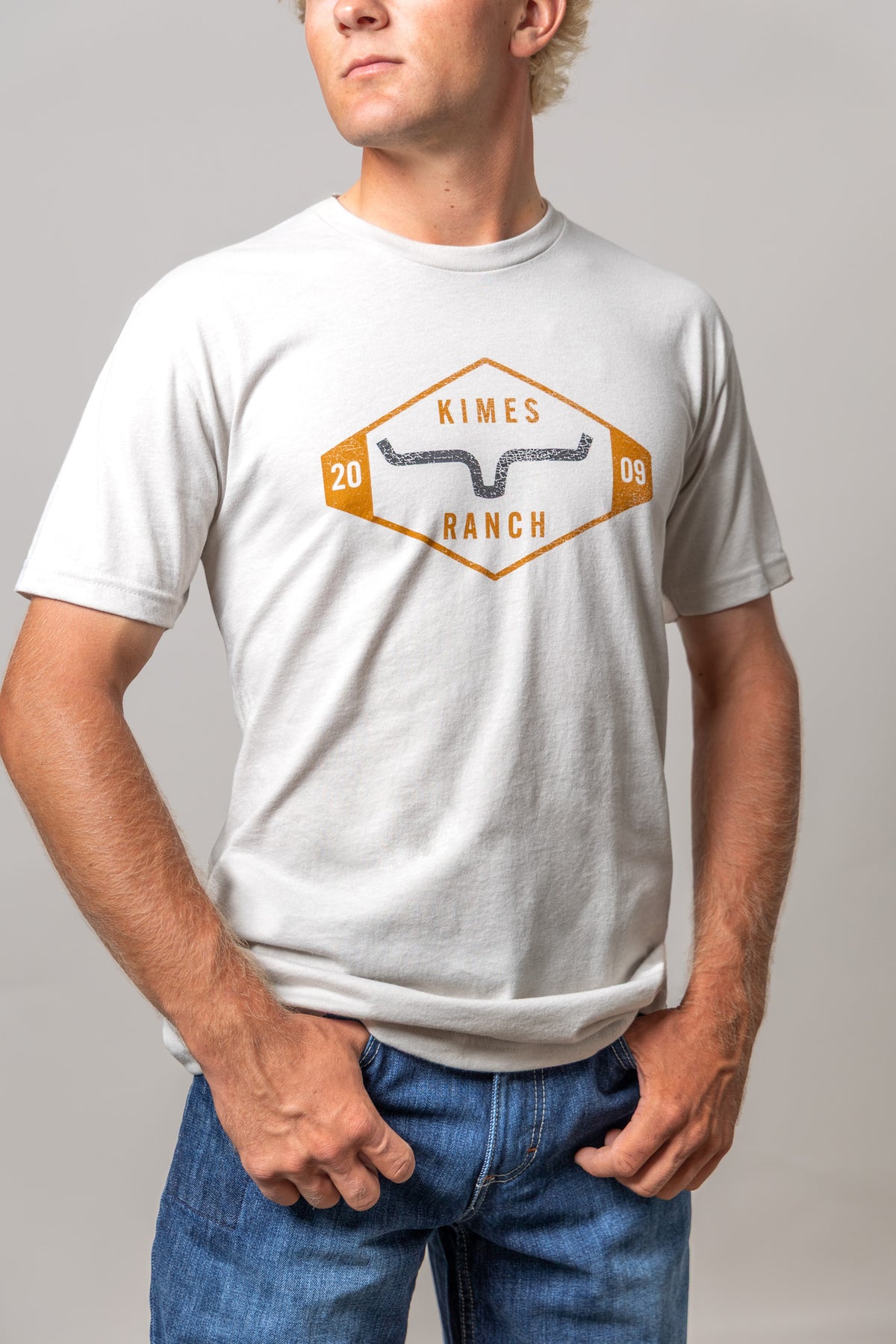 Kimes Ranch Serrano shirt in Sand with a vintage diamond logo graphic featuring the brand name and longhorn mark