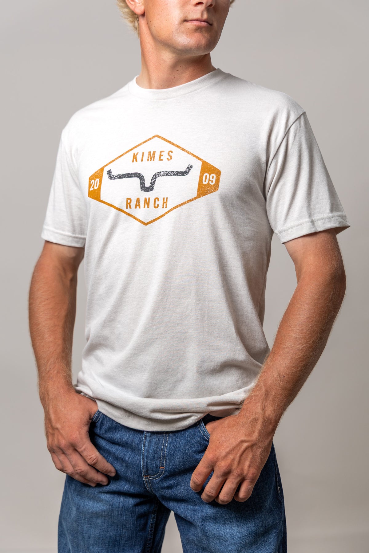 Kimes Ranch Serrano shirt in Sand with a vintage diamond logo graphic featuring the brand name and longhorn mark