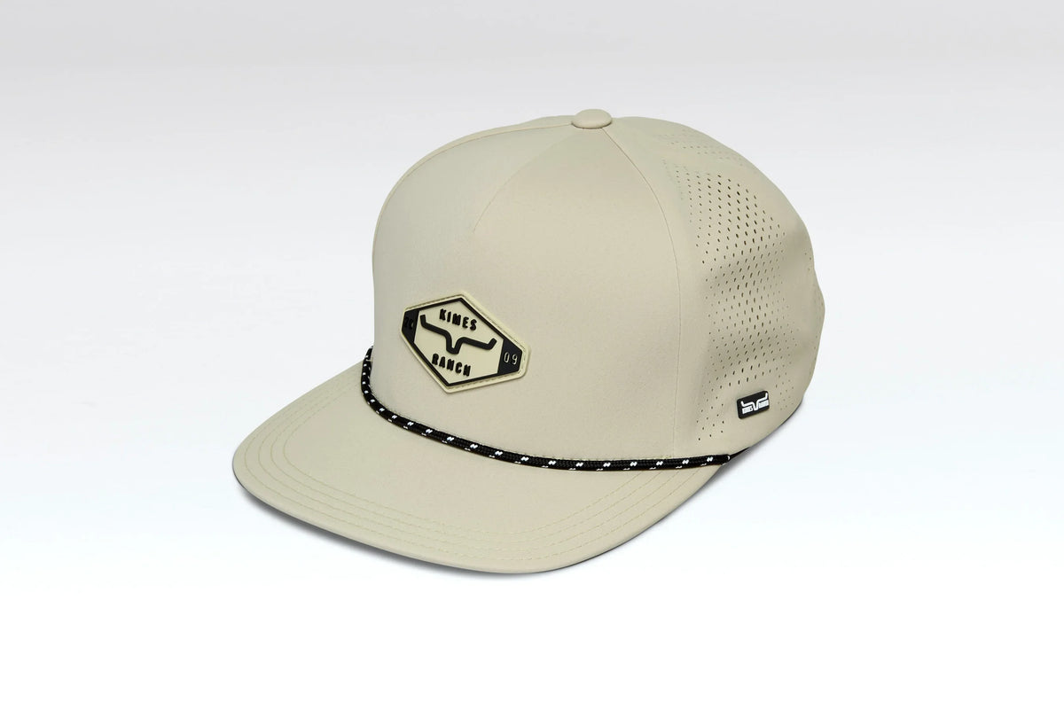 Kimes Ranch Serrano Trucker hat in Straw, side view, with a Kimes Ranch logo patch and a black and white braided hat band
