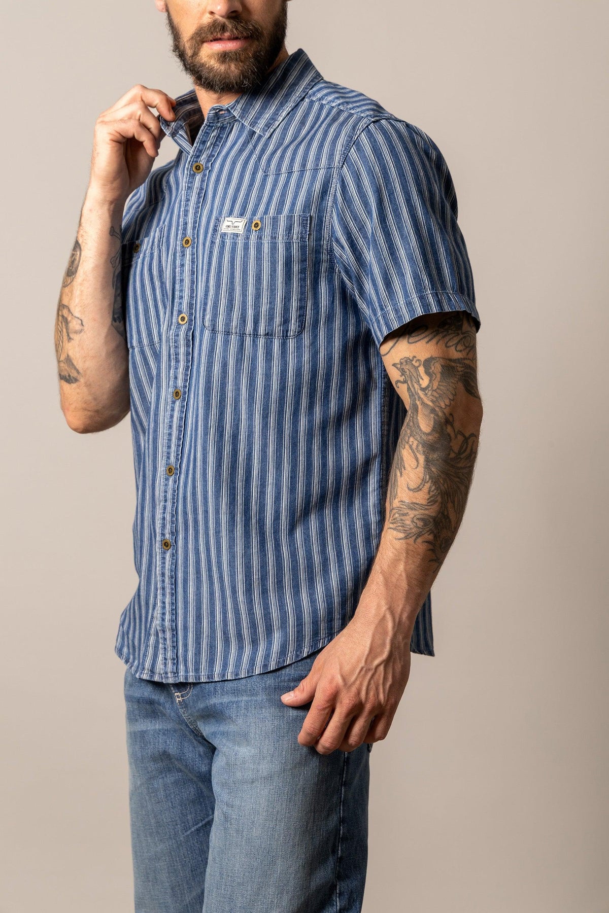 Kimes Ranch Shifter dress shirt in Indigo Stripe, side view, with short sleeves and chest pockets