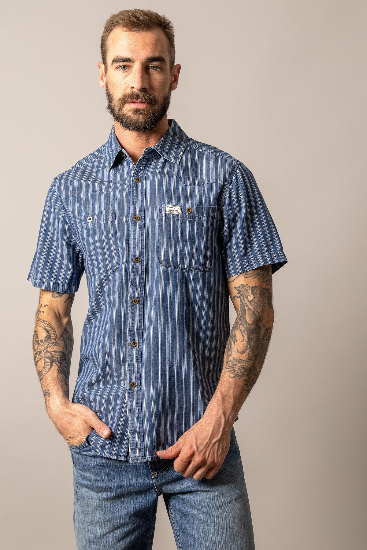Kimes Ranch Shifter short sleeve dress shirt in Indigo Stripe with chest pockets and logo patch