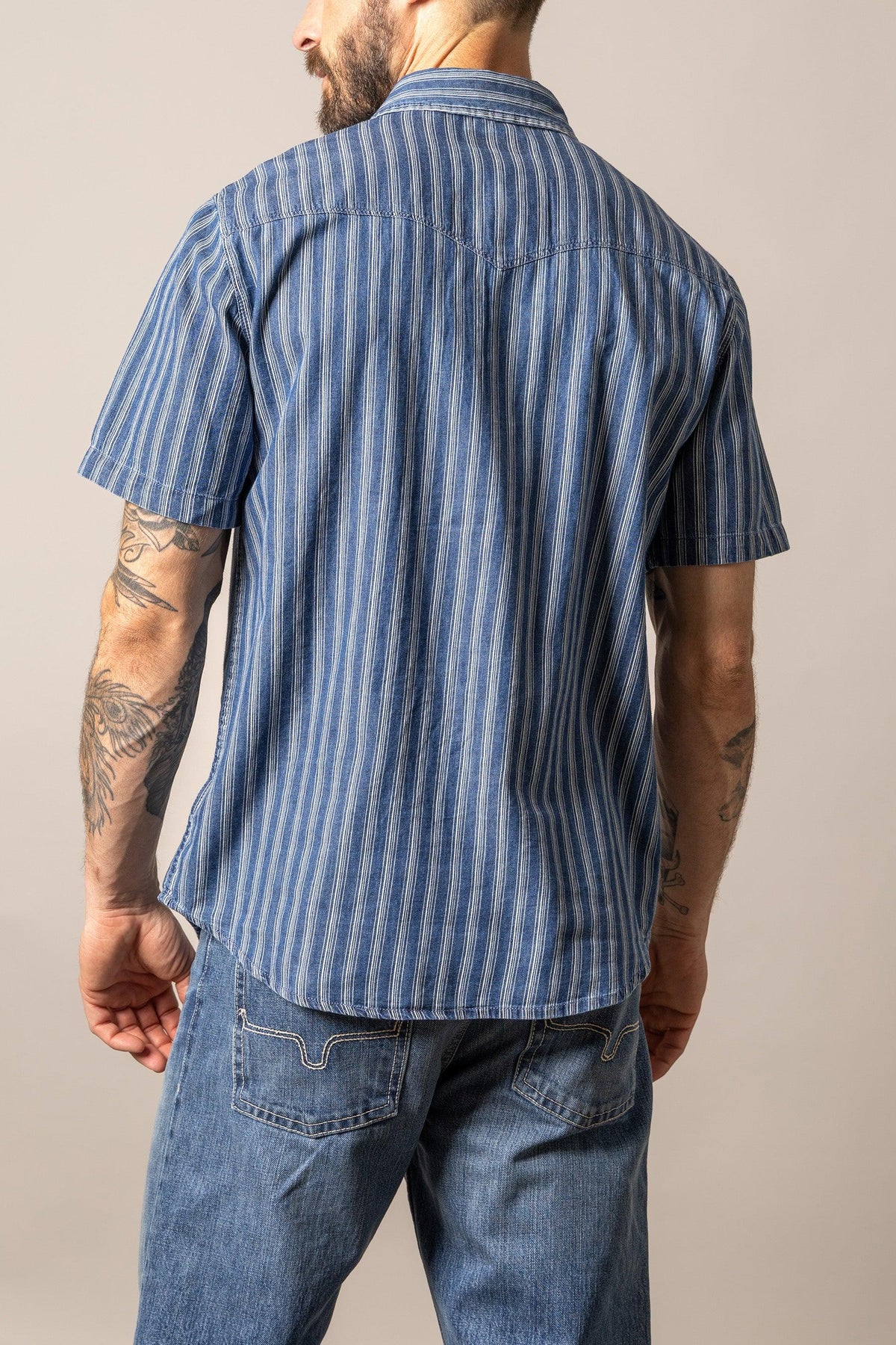 Kimes Ranch Shifter dress shirt in Indigo Stripe, back view, with short sleeves and a back yoke