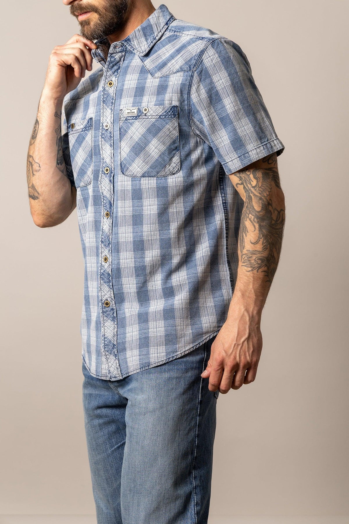 Kimes Ranch Shifter short sleeve dress shirt in Indigo Plaid with two chest pockets and a logo patch